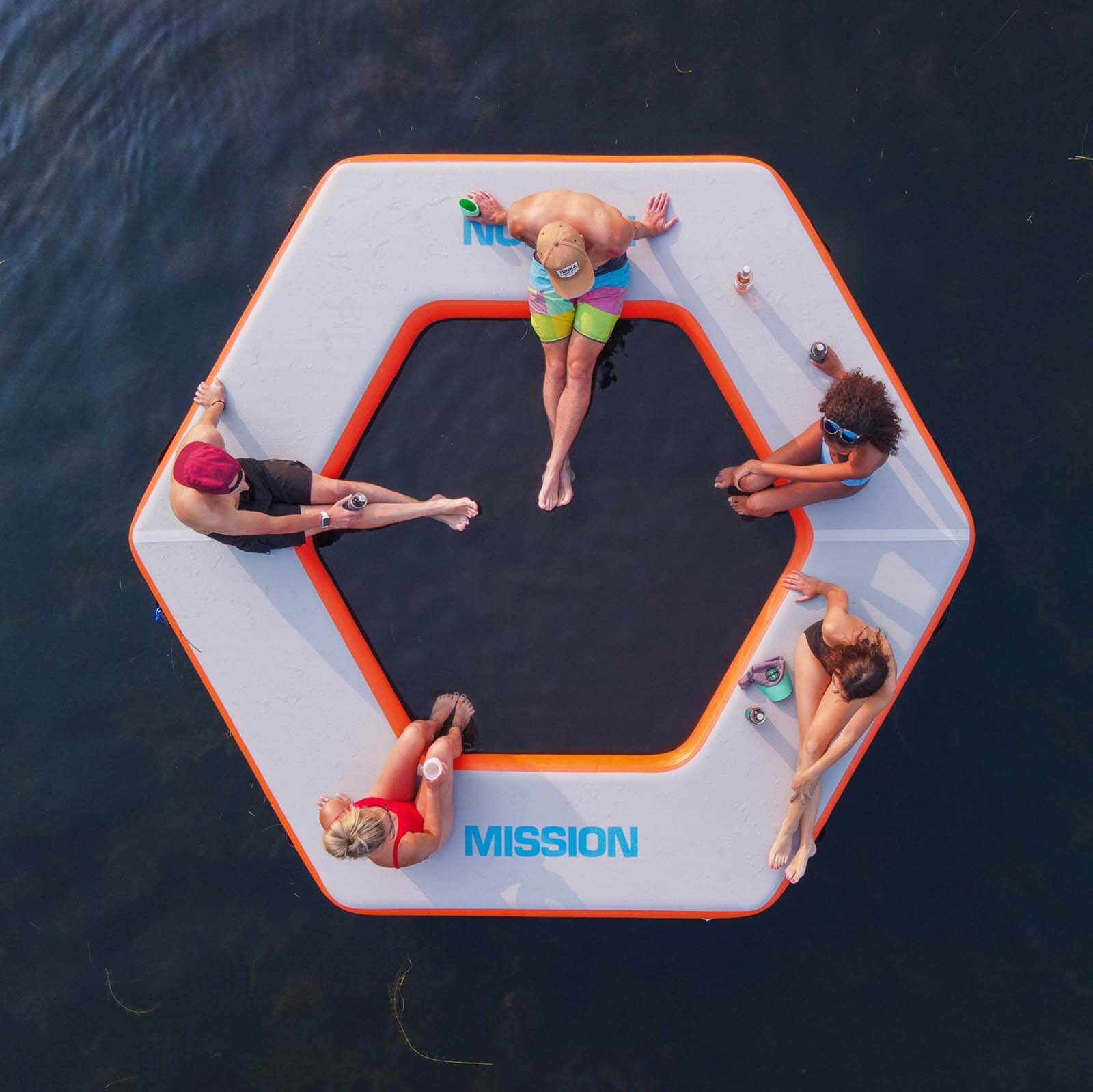 Group of people sitting on REEF SPLASH Inflatable Water Mat