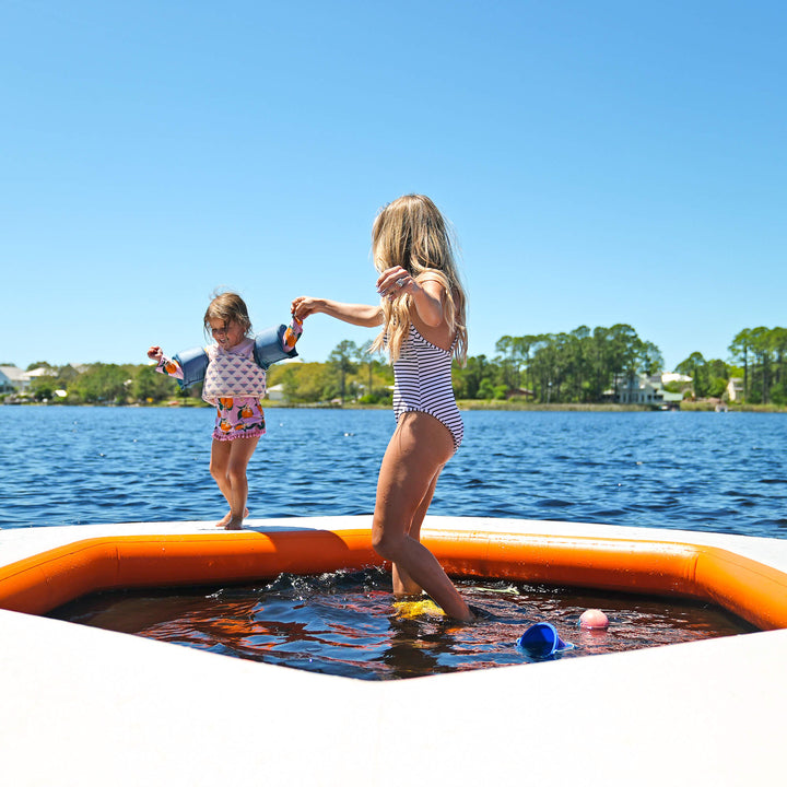 Child and parent playing on REEF SPLASH mat