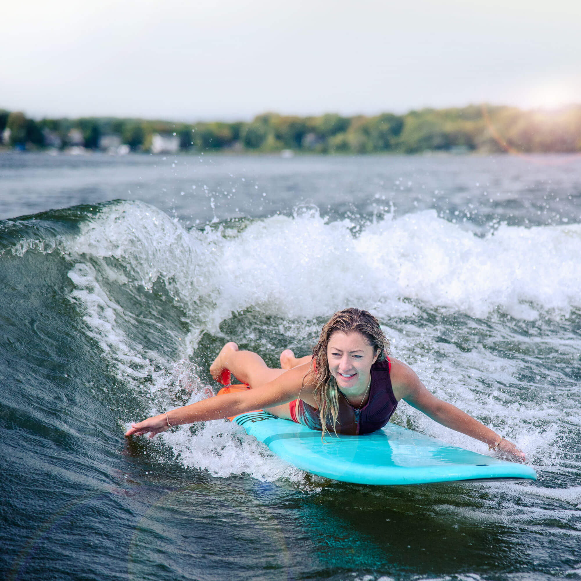 person paddling on TANGO Wakesurf Board 