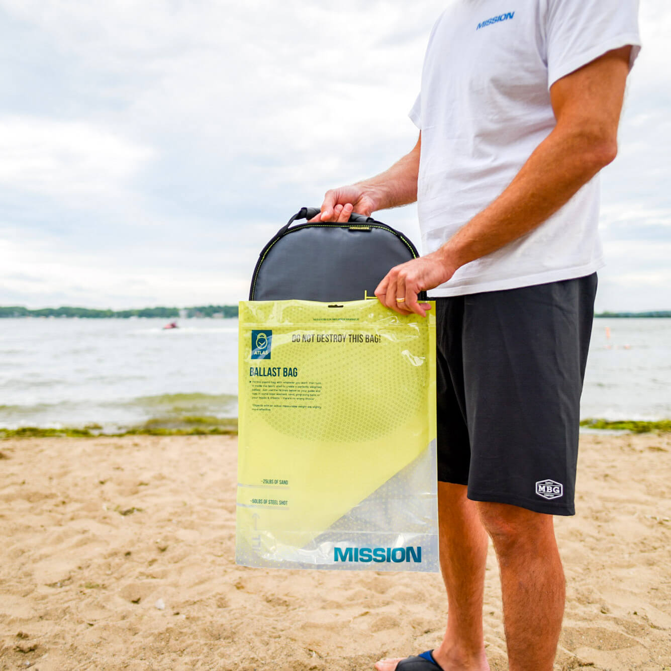 person taking ballast bag out of packaging