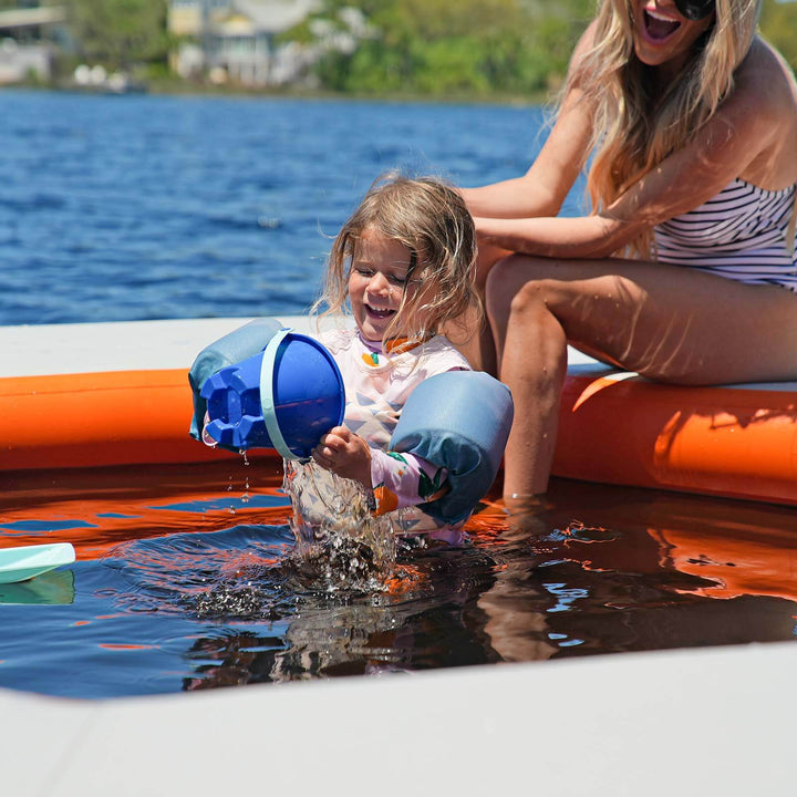 Child and parent in REEF SPLASH Mat
