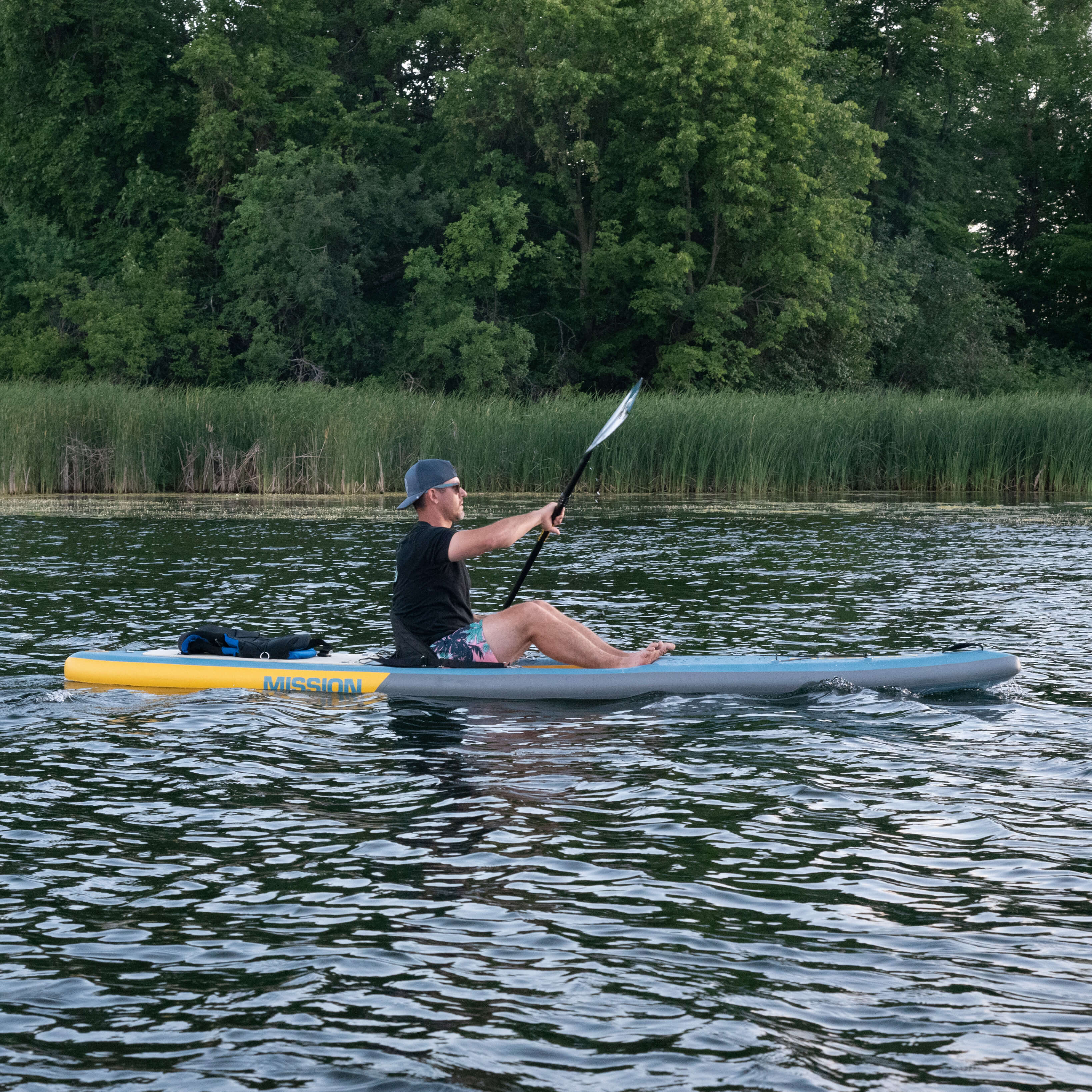 person paddling in STILLWATER Inflatable Kayak + iSUP Crossover