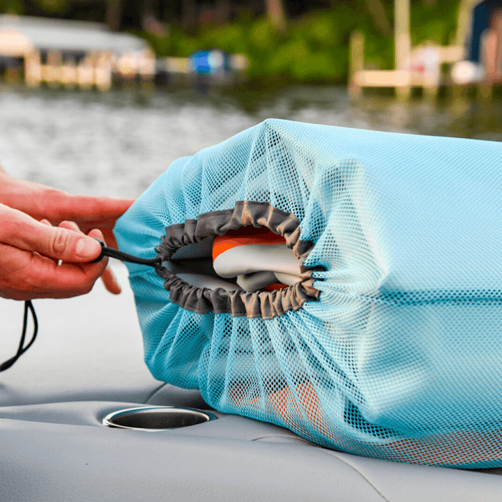 person putting titan fender in storage bag