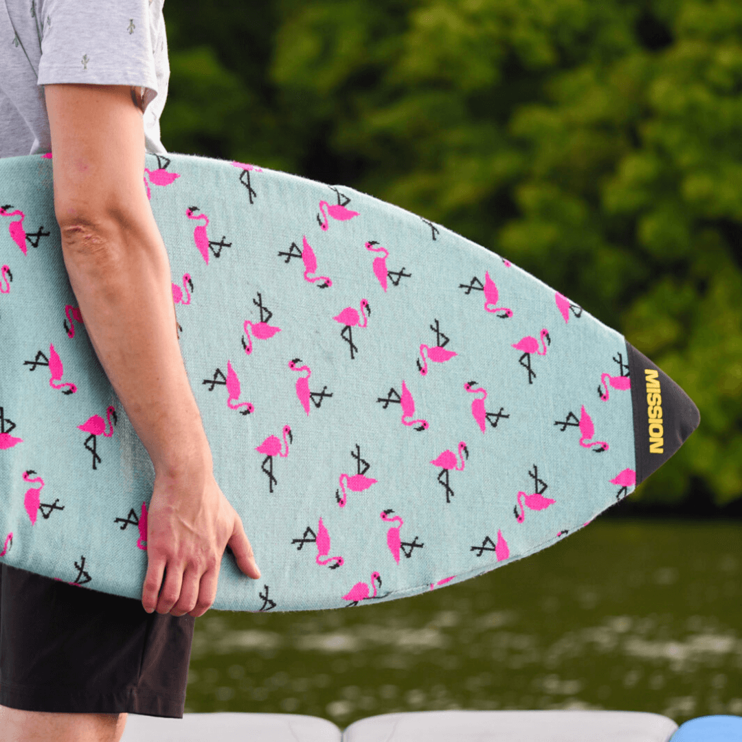 person carrying flamingo board sock