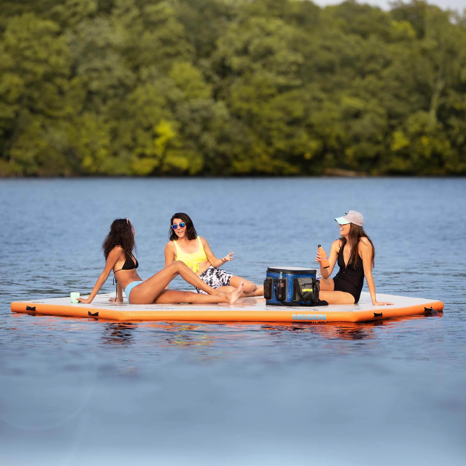 People sitting on inflatable reef Mat