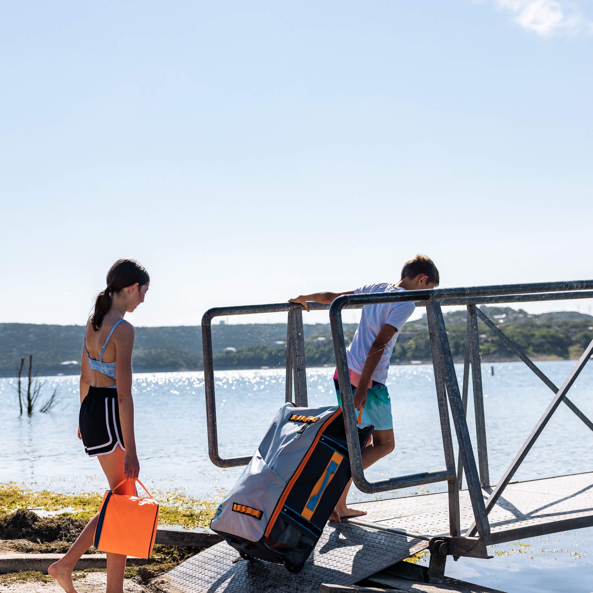 Person carrying reef mat in portable bag